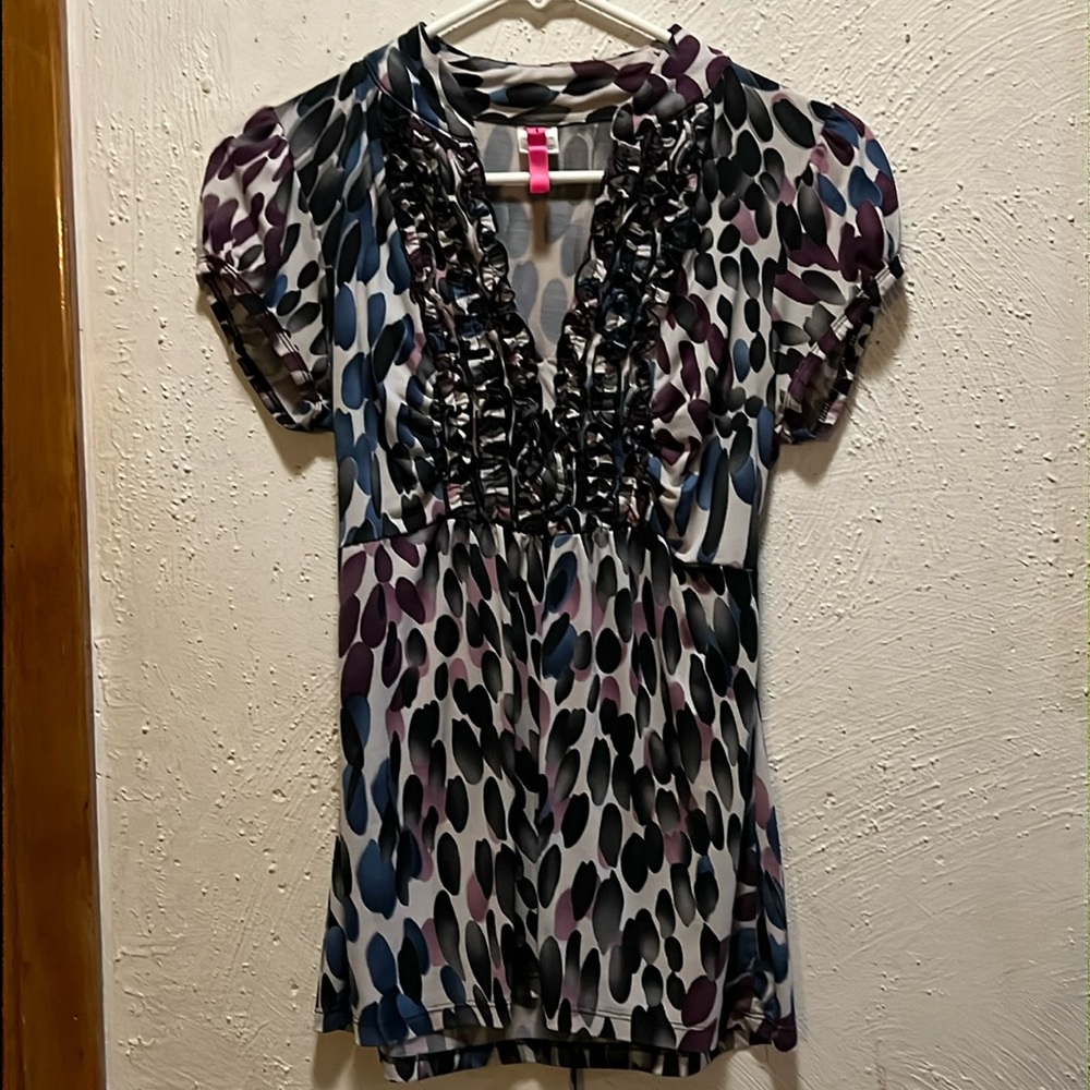Silky v-neck work shirt with tie in the back.